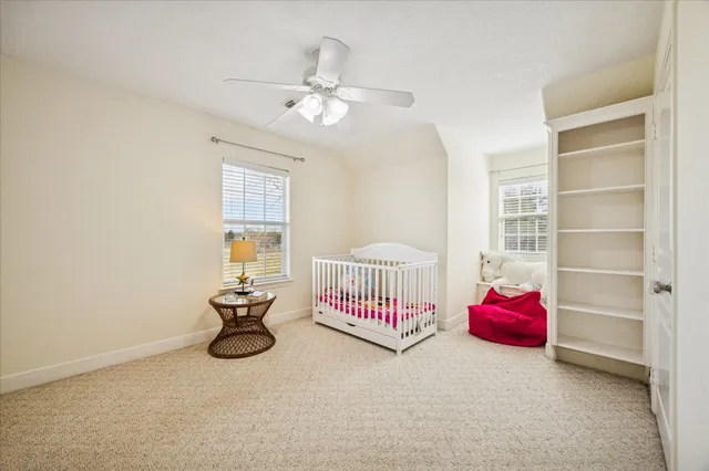 a bedroom with furniture and white walls