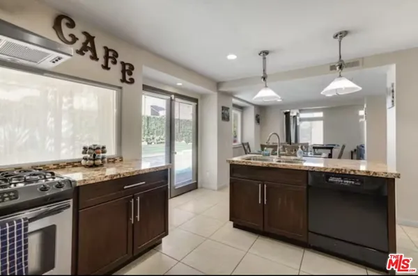 a kitchen with a sink and stove