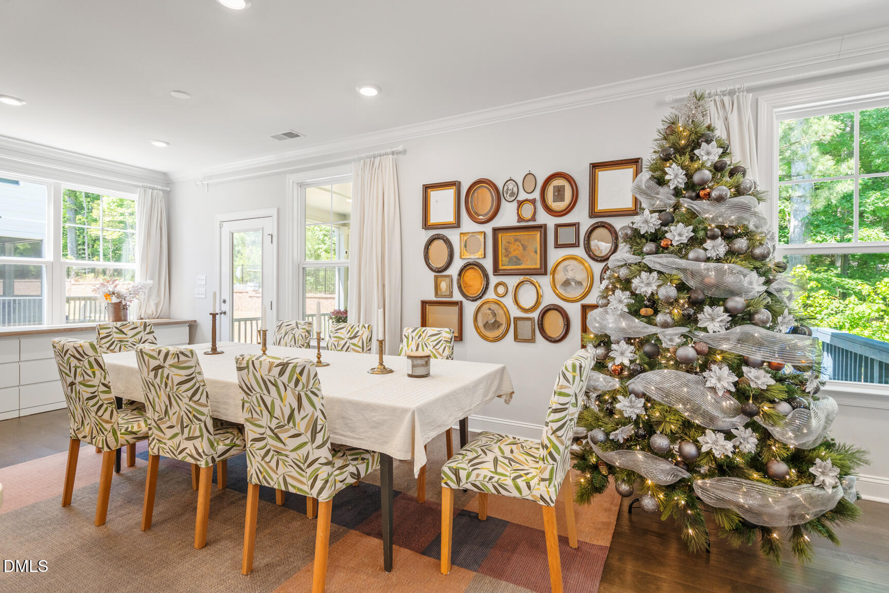 2966 Rise And Shine Road Apex, NC 27502 - Photo 24 of 61 a view of a dining room with furniture and a large window