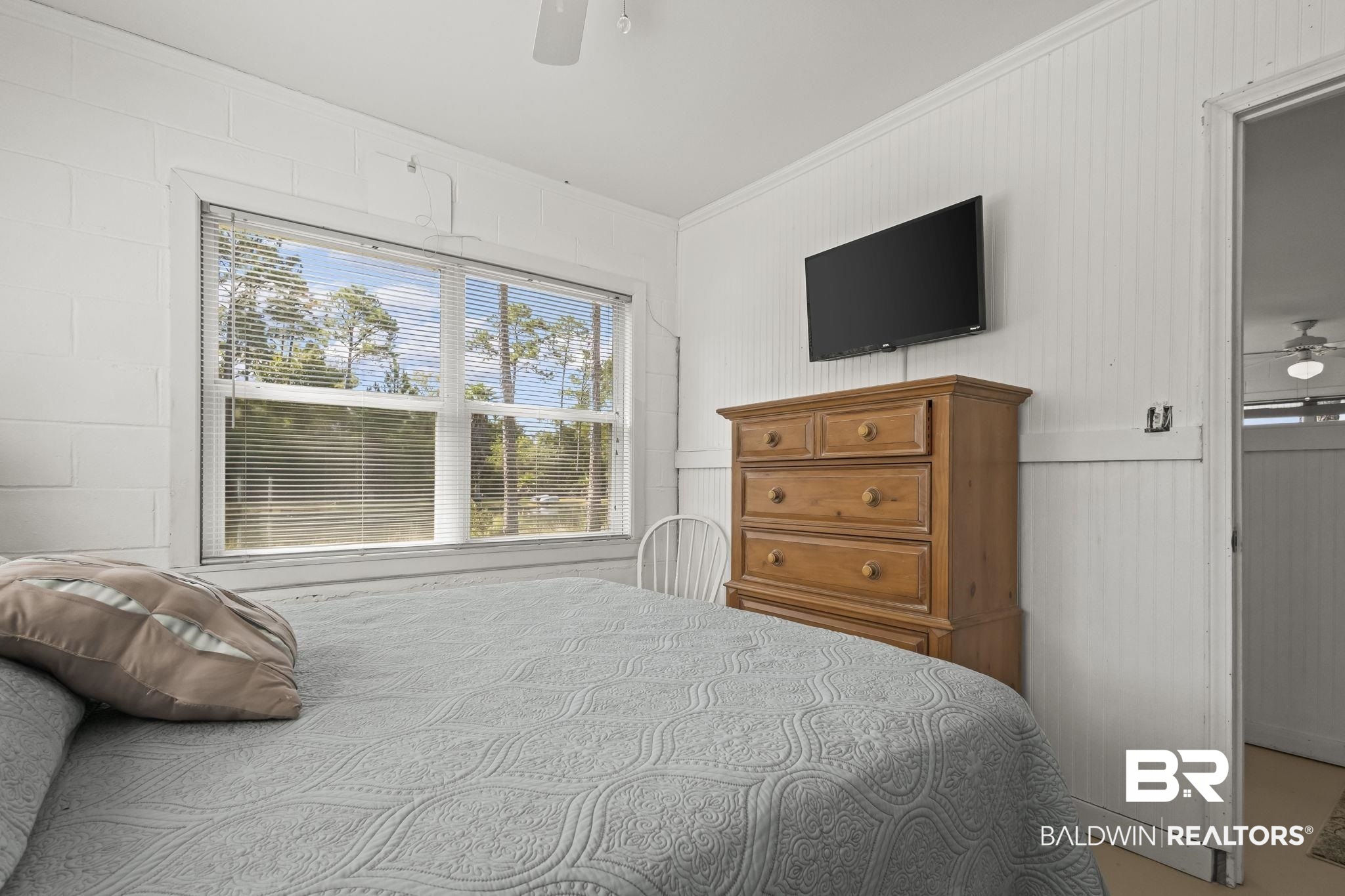 7849 Bayshore Drive Elberta, AL 36530 - Photo 28 of 47 Bedroom featuring ceiling fan and ornamental molding