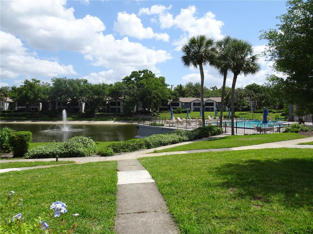 2 Escondido Circle, Unit 185 Altamonte Springs, FL 32701 - Photo 5 of 6 a view of a park with a big trees