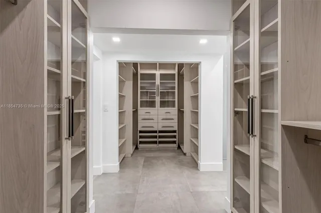 a view of walk in closet and stairs