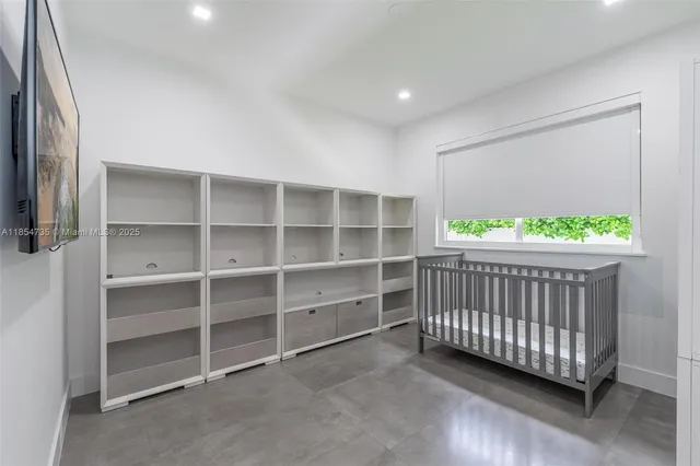 a view of a bedroom with a window