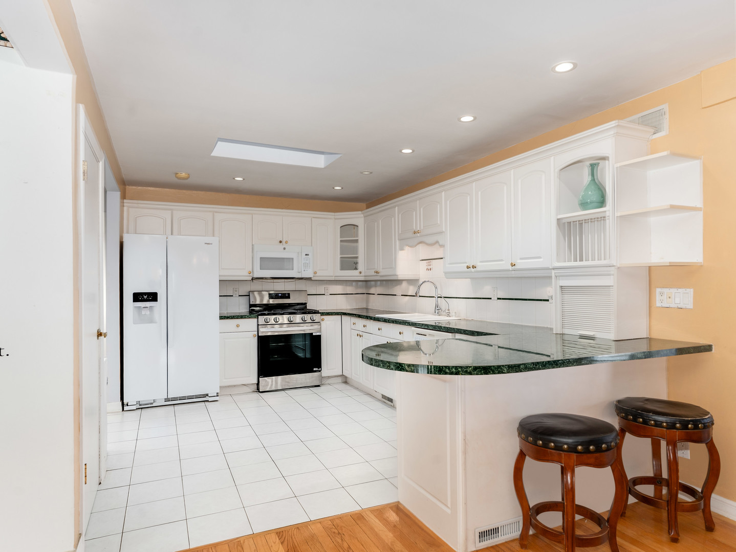 178 Brookhill Road Libertyville, IL 60048 - Photo 14 of 39 a kitchen with granite countertop white cabinets and appliances