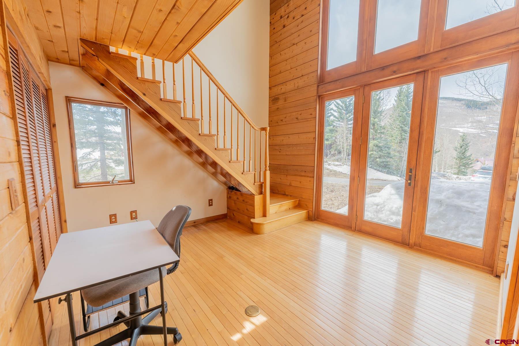 10 Arrowhead Circle Crested Butte, CO 81225 - Photo 19 of 33 a livingroom with furniture staircase and a floor to ceiling window