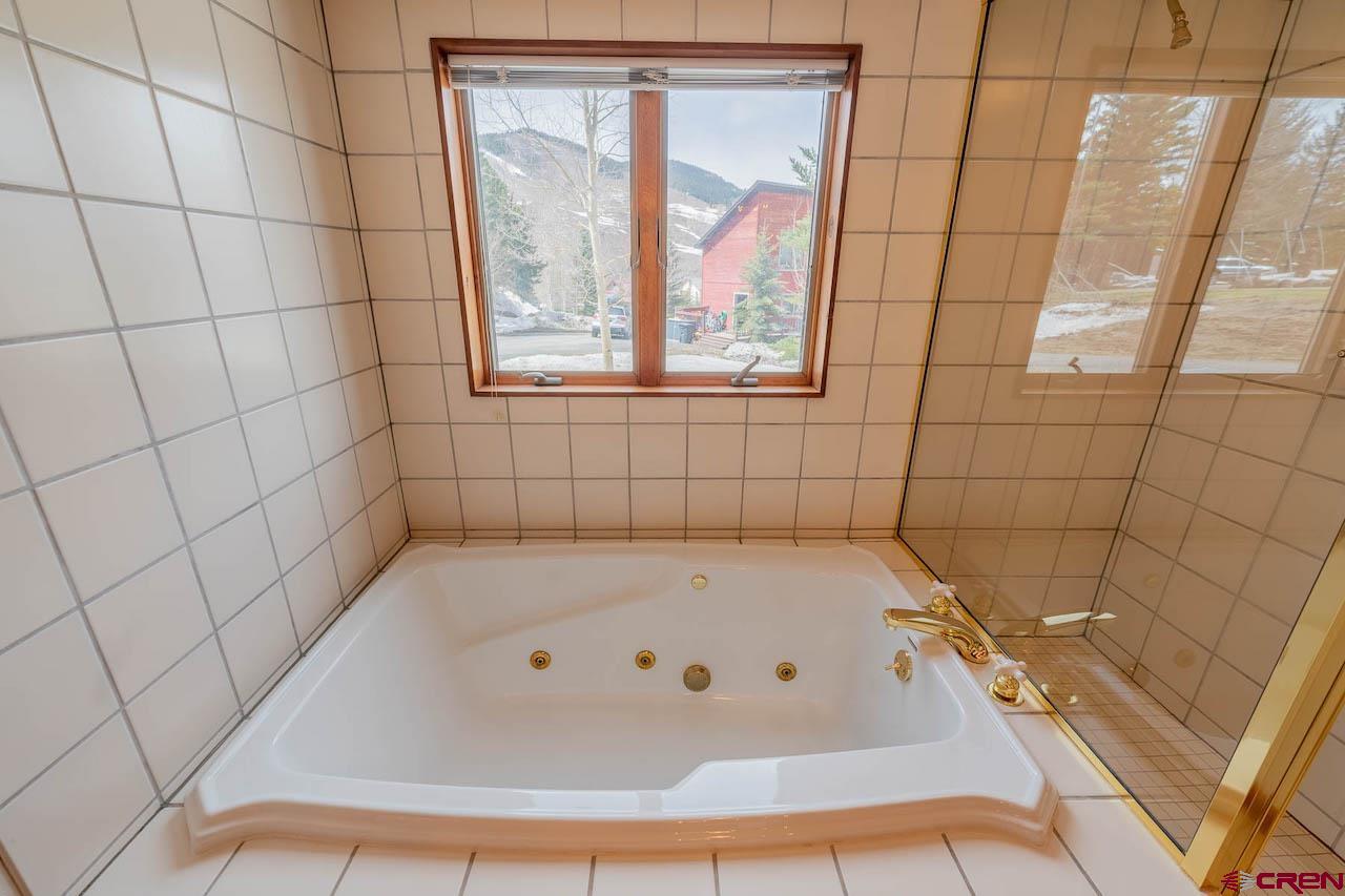 10 Arrowhead Circle Crested Butte, CO 81225 - Photo 22 of 33 a bathroom with a bathtub