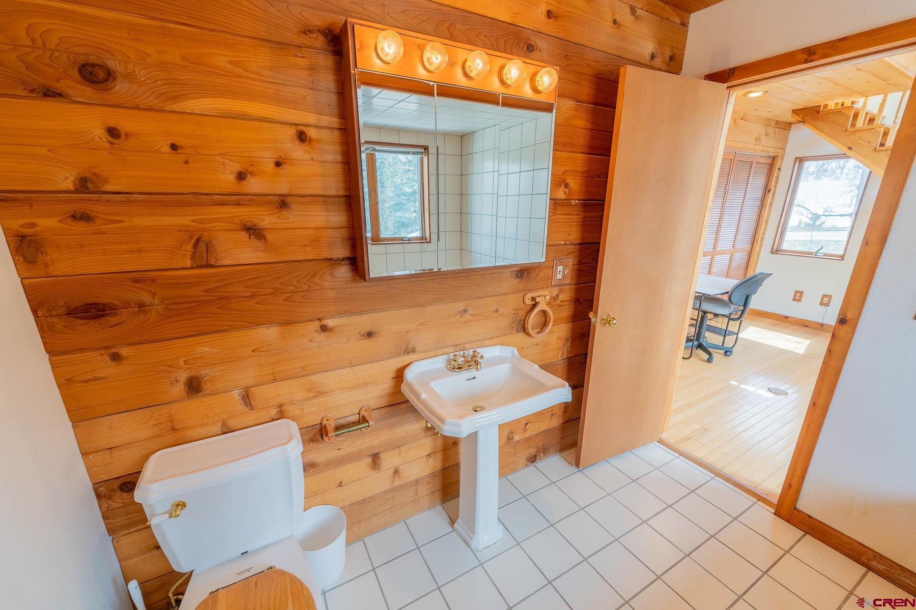 10 Arrowhead Circle Crested Butte, CO 81225 - Photo 23 of 33 a bathroom with a sink and mirror