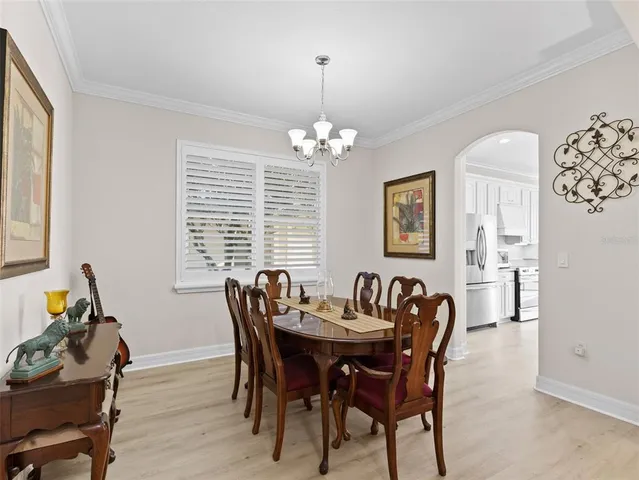 a kitchen with sink and cabinets