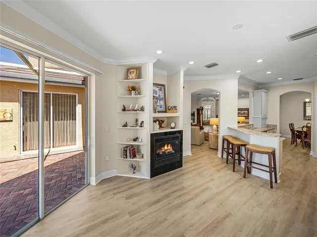 a living room with furniture and large windows
