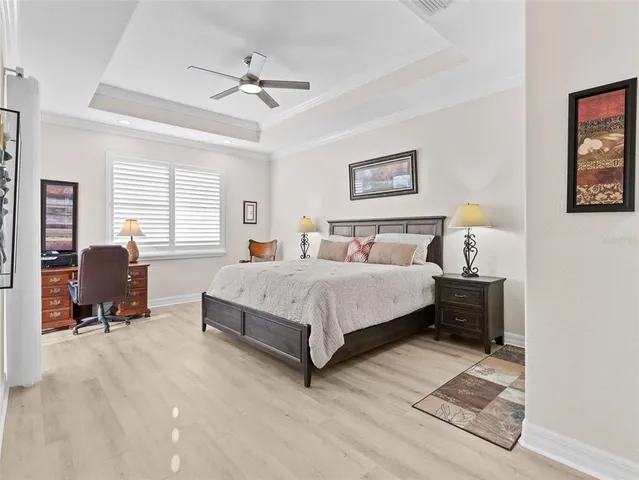 a bedroom with a bed dresser and a window