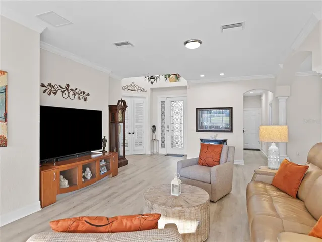 a view of a dining room with furniture and chandelier
