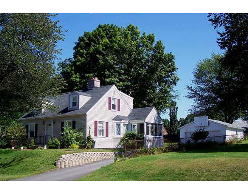 74 Ely Avenue West Springfield, MA 01089 - Photo 1 of 22 a front view of a house with a garden
