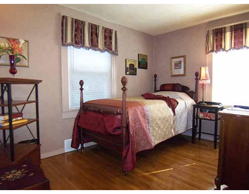 74 Ely Avenue West Springfield, MA 01089 - Photo 13 of 22 a bedroom with a bed and wooden floor
