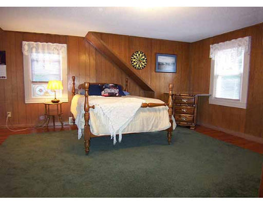 74 Ely Avenue West Springfield, MA 01089 - Photo 16 of 22 a bed room with a bed and a table