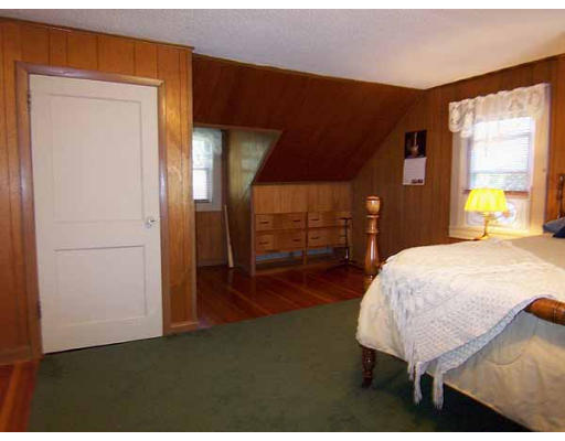 74 Ely Avenue West Springfield, MA 01089 - Photo 17 of 22 a bed sitting in a spacious bedroom next to a window