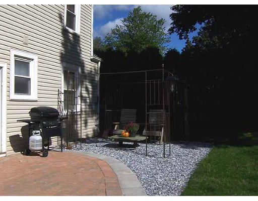 74 Ely Avenue West Springfield, MA 01089 - Photo 20 of 22 a view of backyard with plants and a bench
