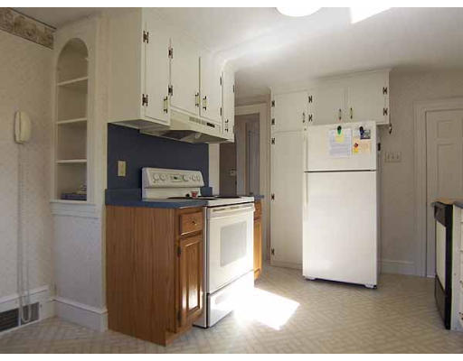 74 Ely Avenue West Springfield, MA 01089 - Photo 7 of 22 a kitchen with stainless steel appliances a refrigerator a stove a white cabinet and a refrigerator