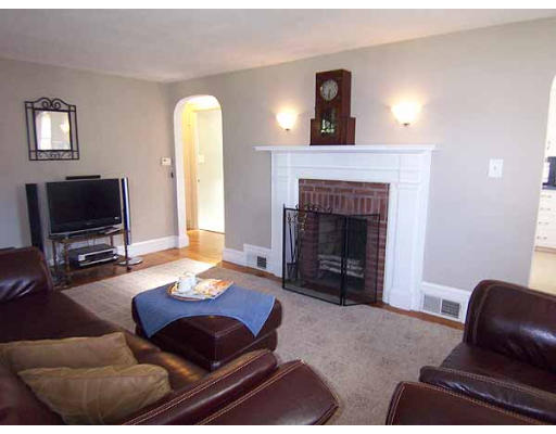 74 Ely Avenue West Springfield, MA 01089 - Photo 8 of 22 a living room with furniture and a fireplace