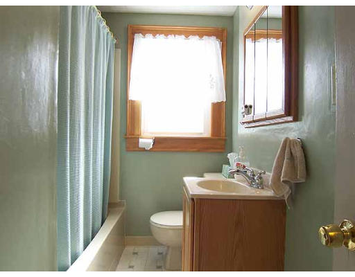 74 Ely Avenue West Springfield, MA 01089 - Photo 10 of 22 a bathroom with a sink toilet and mirror