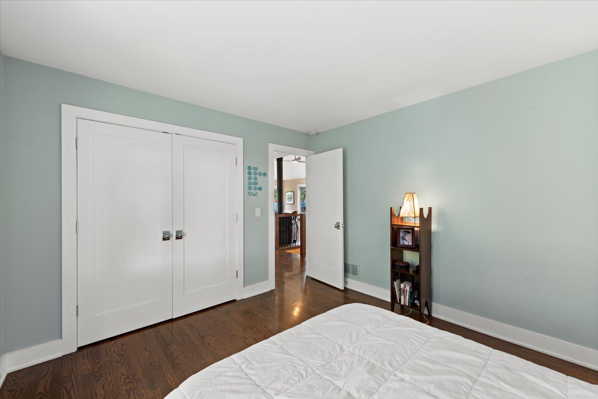5908 Edgewood Road Crystal Lake, IL 60012 - Photo 18 of 60 a bedroom with a bed and a wooden floor