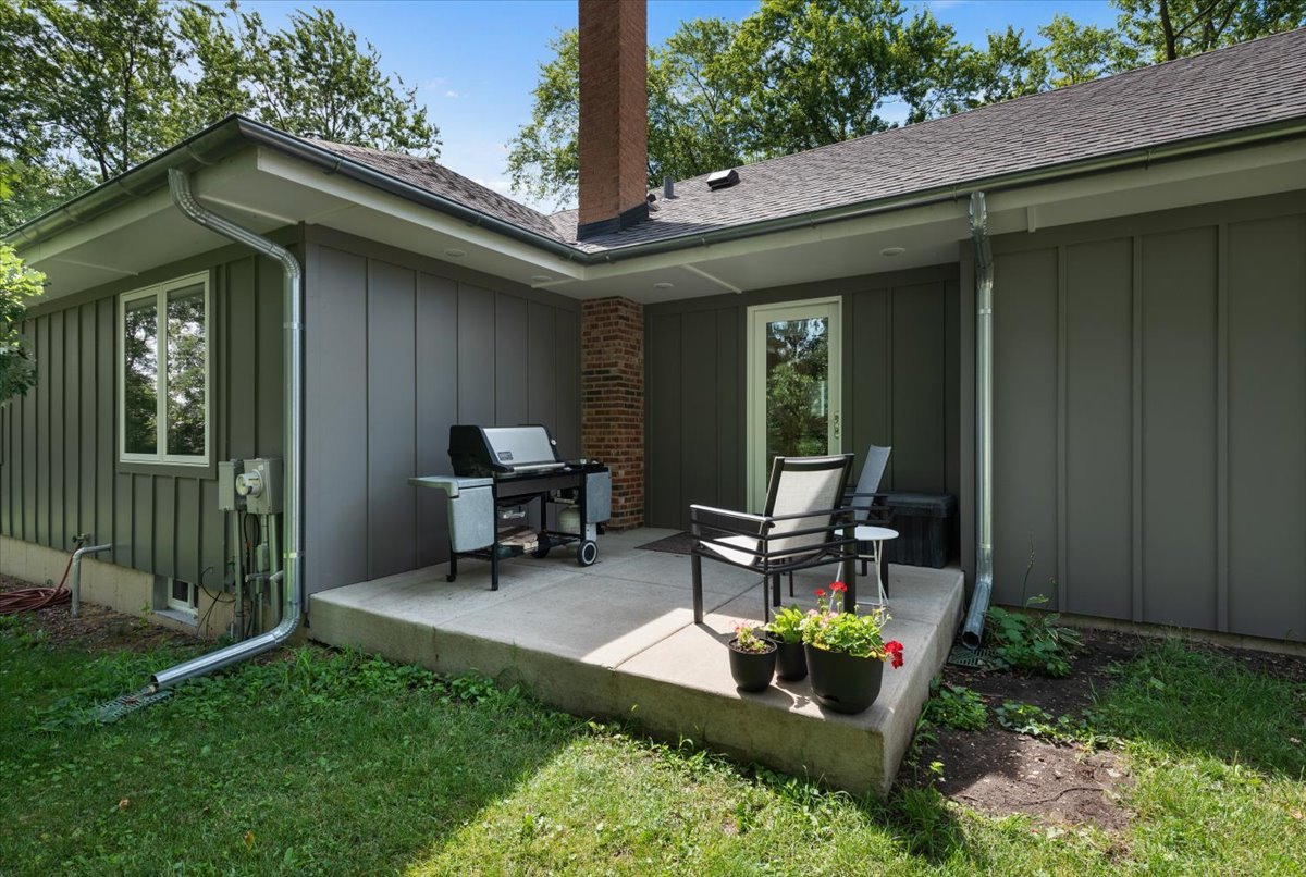 5908 Edgewood Road Crystal Lake, IL 60012 - Photo 26 of 60 a view of a chair and table in backyard of the house