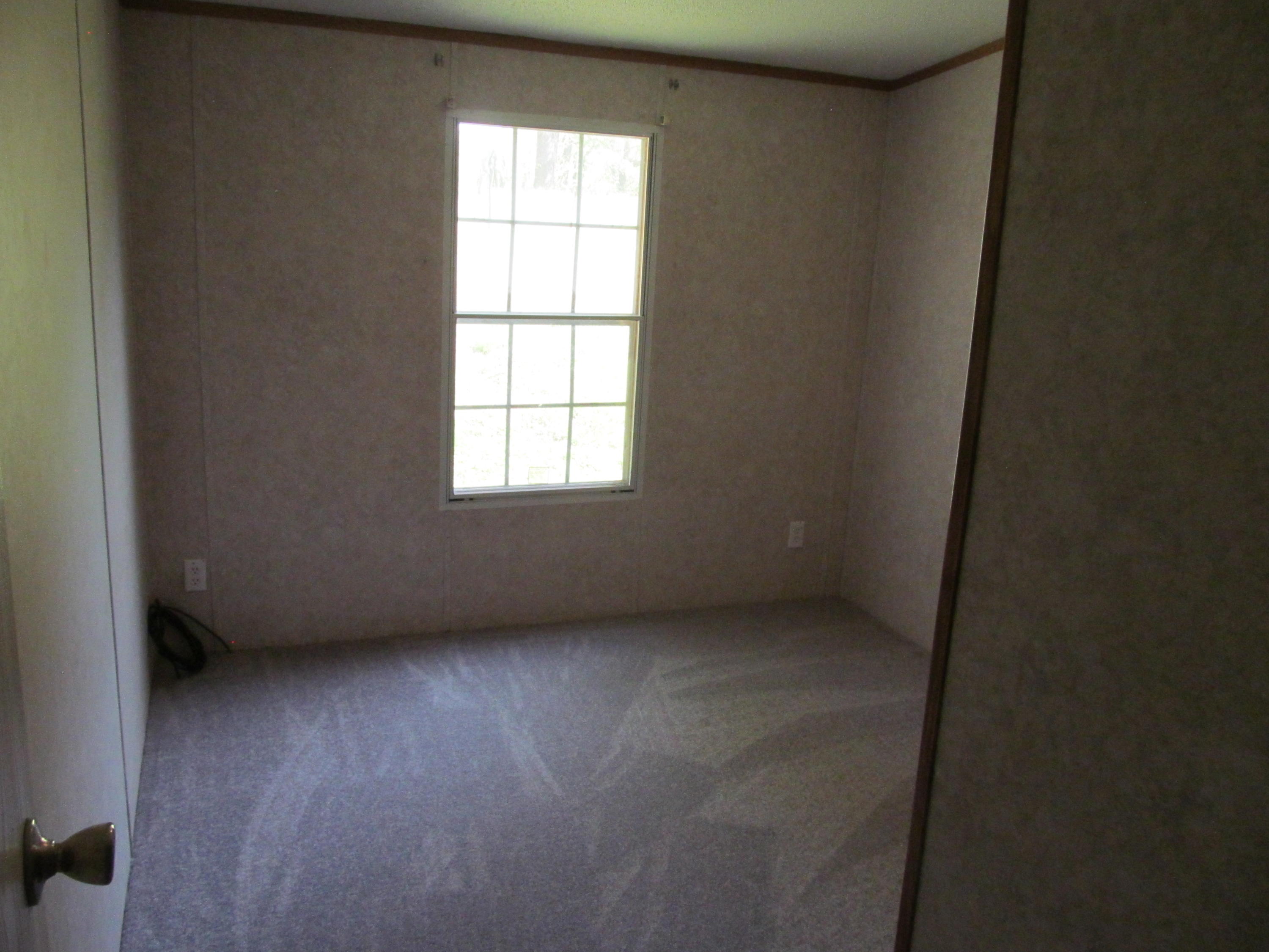 312 Piney Branch Road Blue Ridge, VA 24064 - Photo 11 of 21 an empty room with a window