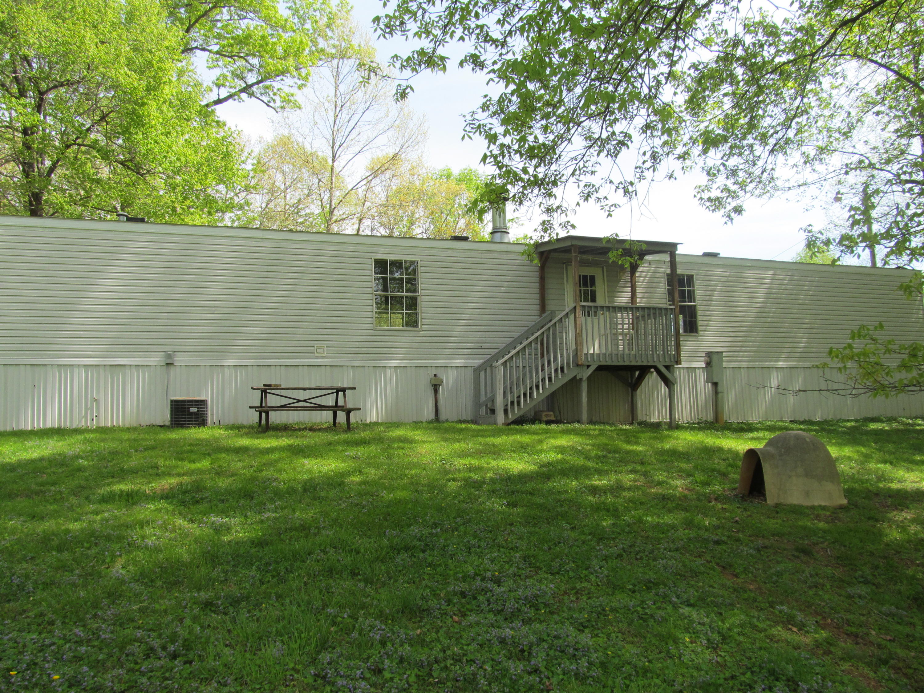 312 Piney Branch Road Blue Ridge, VA 24064 - Photo 18 of 21 a backyard of a house with table and chairs
