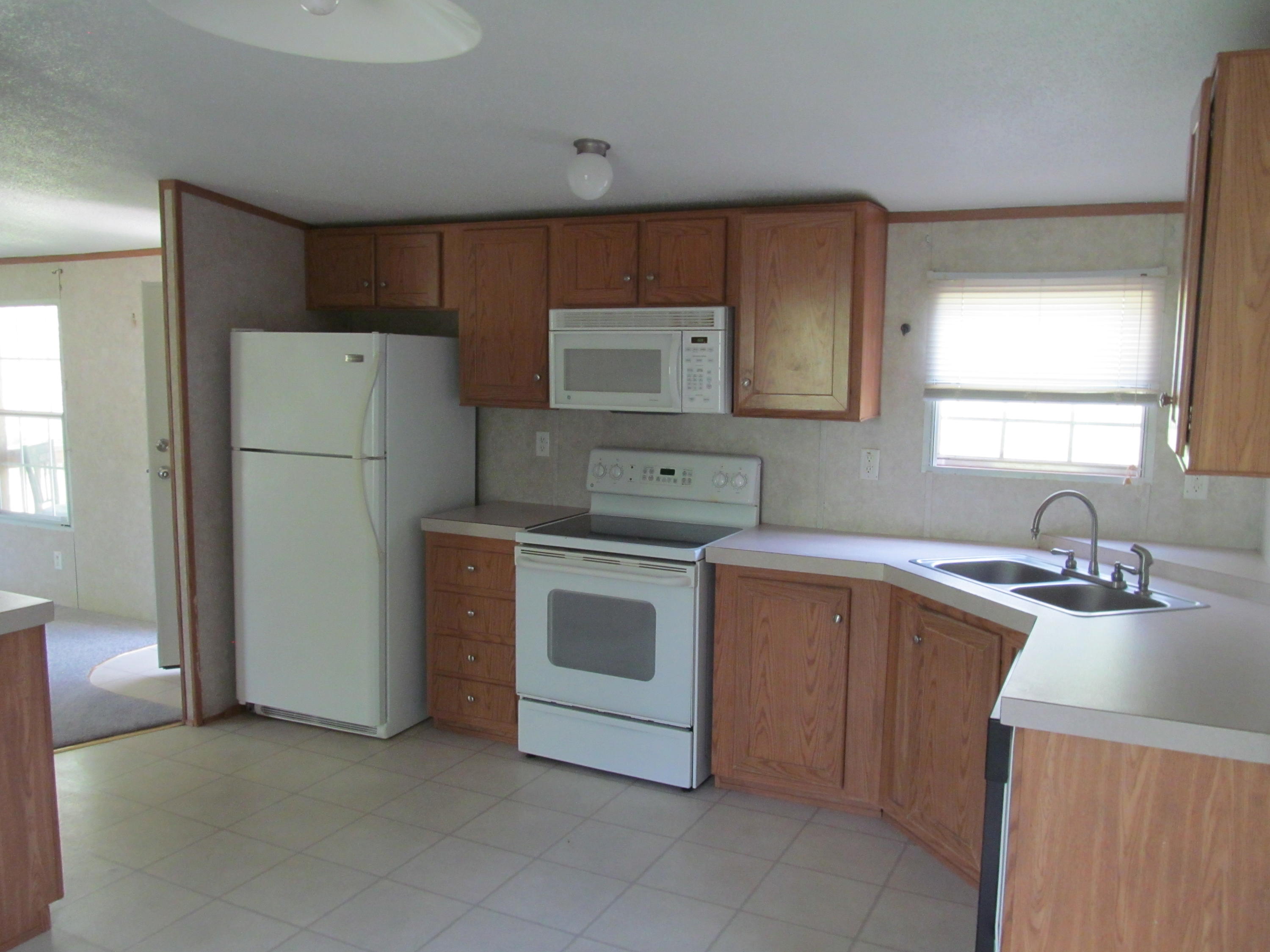 312 Piney Branch Road Blue Ridge, VA 24064 - Photo 5 of 21 a kitchen with a stove sink and refrigerator