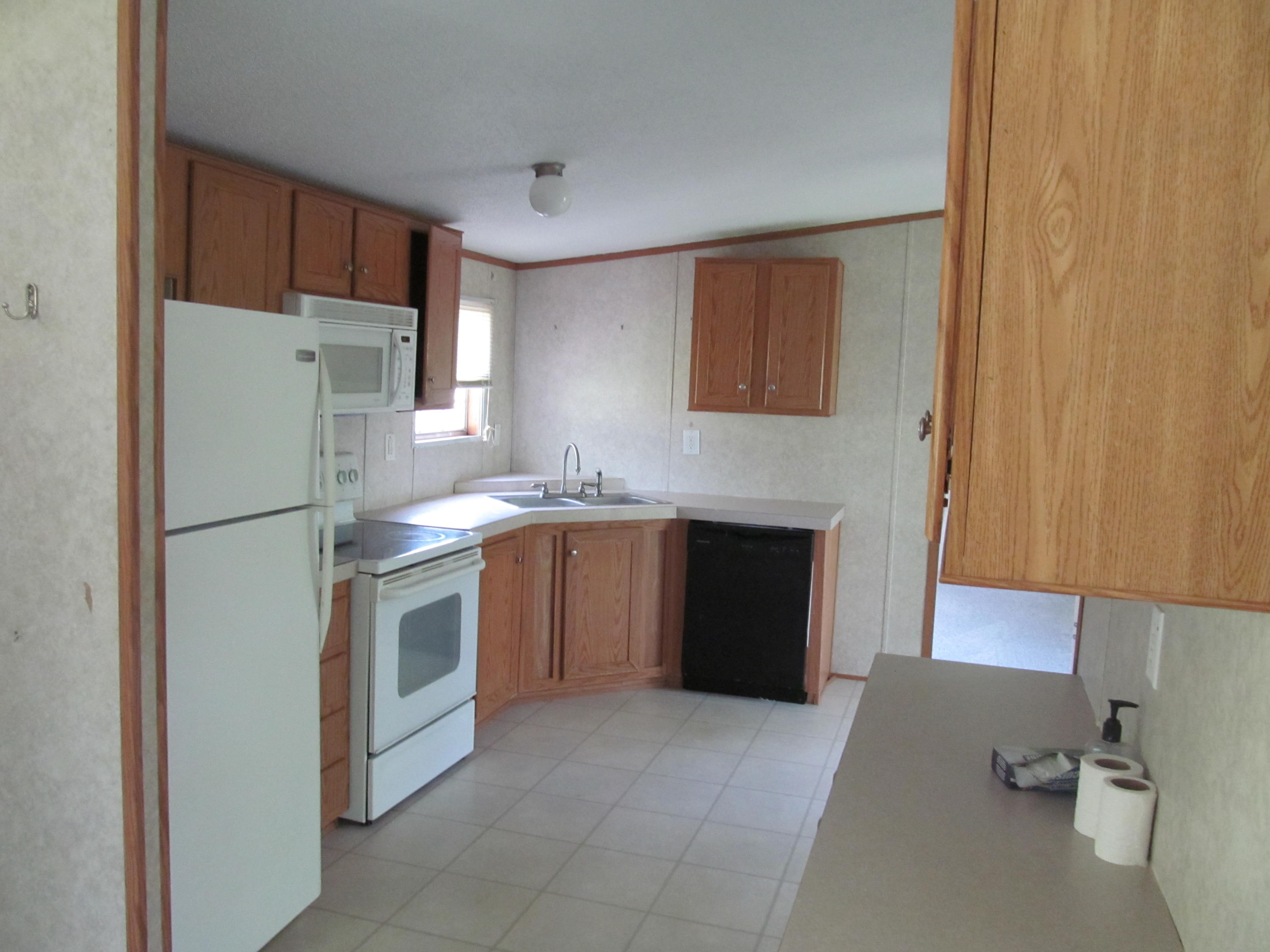 312 Piney Branch Road Blue Ridge, VA 24064 - Photo 6 of 21 a kitchen with stainless steel appliances granite countertop a refrigerator sink and stove