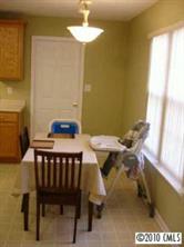 6922 Sullins Road Charlotte, NC 28214 - Photo 6 of 8 a view of a dining room with furniture and a window