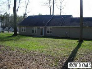 6922 Sullins Road Charlotte, NC 28214 - Photo 8 of 8 a view of a house with a yard