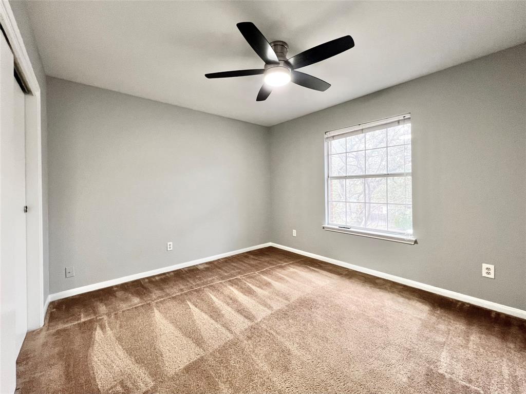 1809 Springwater Drive Round Rock, TX 78681 - Photo 16 of 25 Unfurnished bedroom with a closet, carpet, and a ceiling fan