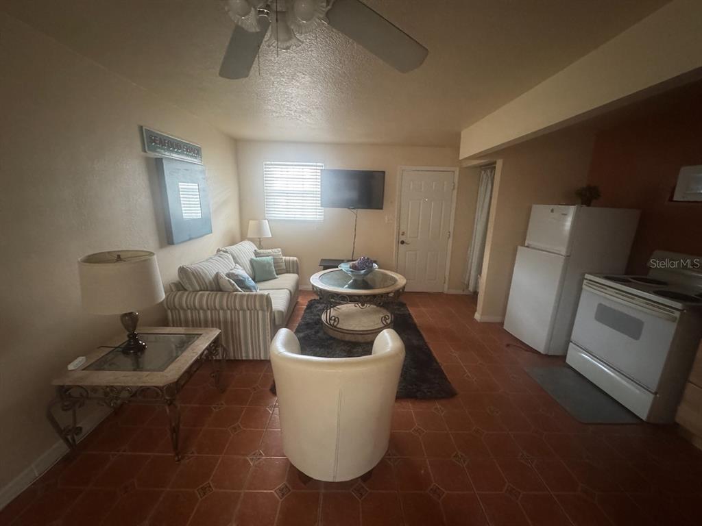14715 Gulf Boulevard, Unit 2 Madeira Beach, FL 33708 - Photo 7 of 9 a room with a sink and a mirror