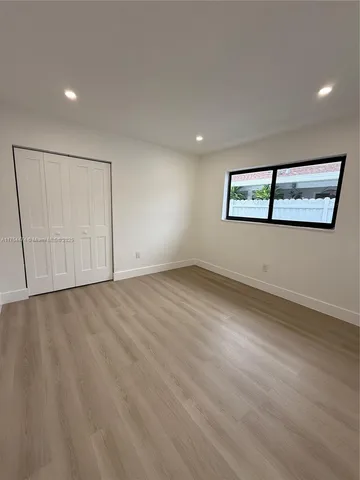 an empty room with a empty space and window