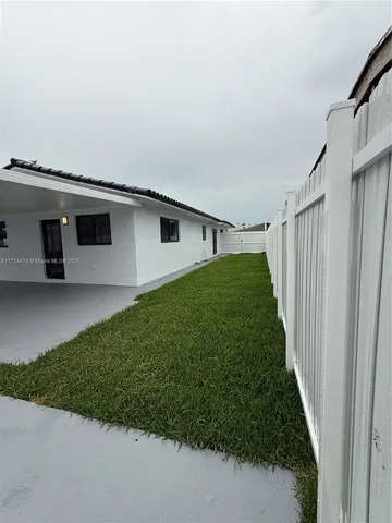 a view of a backyard with plants