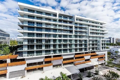 a building view with swimming pool and sitting space