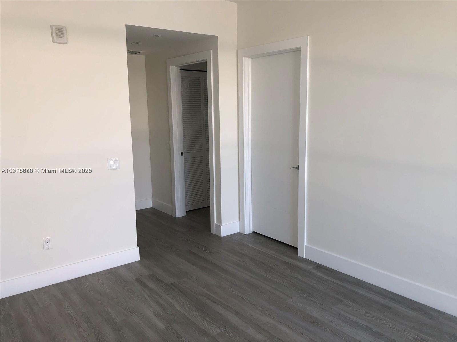 2960 Northeast 207th Street, Unit 1006 Aventura, FL 33180 - Photo 5 of 9 a view of a room with wooden floor