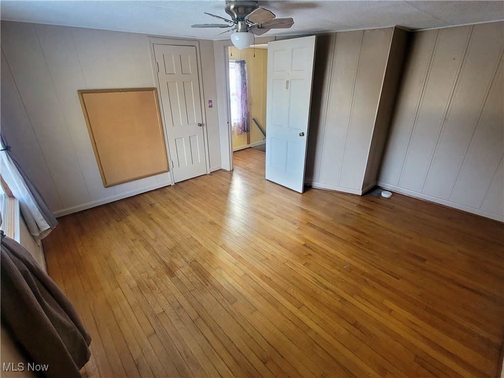 4145 Manchester Road Akron, OH 44319 - Photo 24 of 28 Unfurnished bedroom with light wood finished floors and a ceiling fan