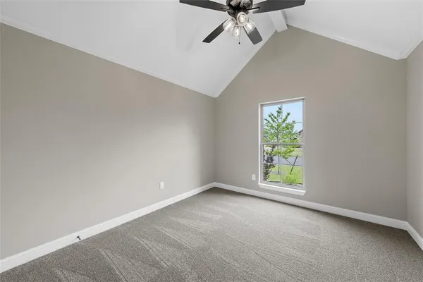 an empty room with a empty space and a ceiling fan