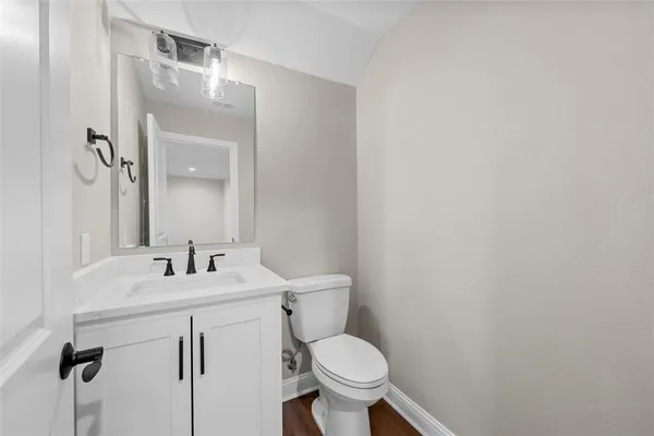 a view of empty room with window and ceiling fan