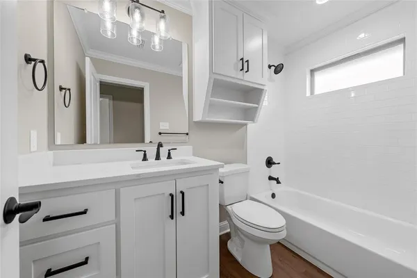 a view of small space with wooden floor and window