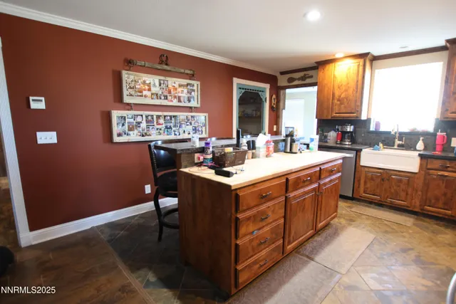 a kitchen with a stove a sink and a refrigerator