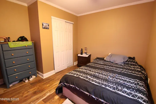 a bedroom with a bed and a dresser