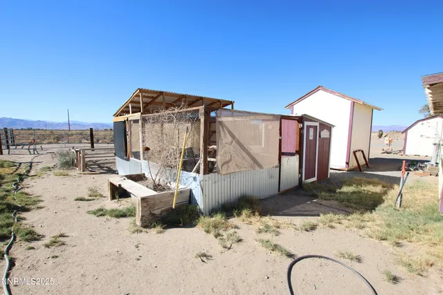 a view of a house with a snow on the road