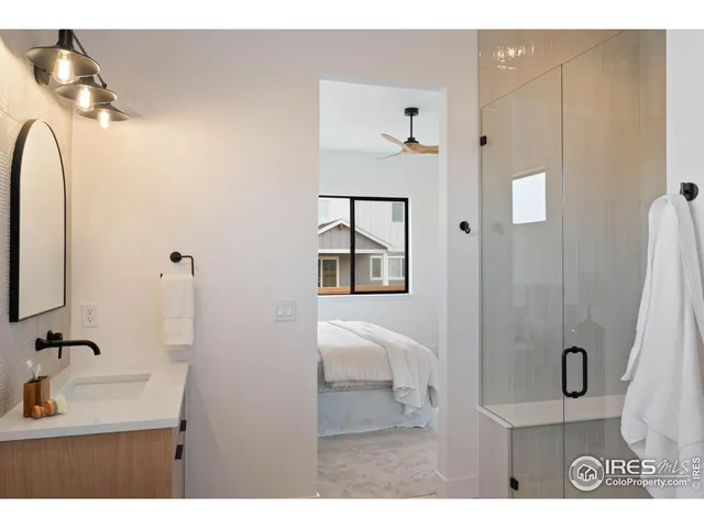 a bathroom with a sink double vanity and a mirror