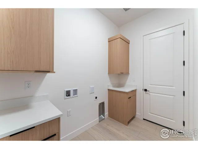 a utility room with closet dryer and washer