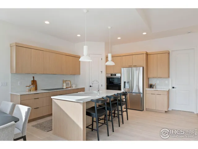 a kitchen with appliances cabinets and a sink