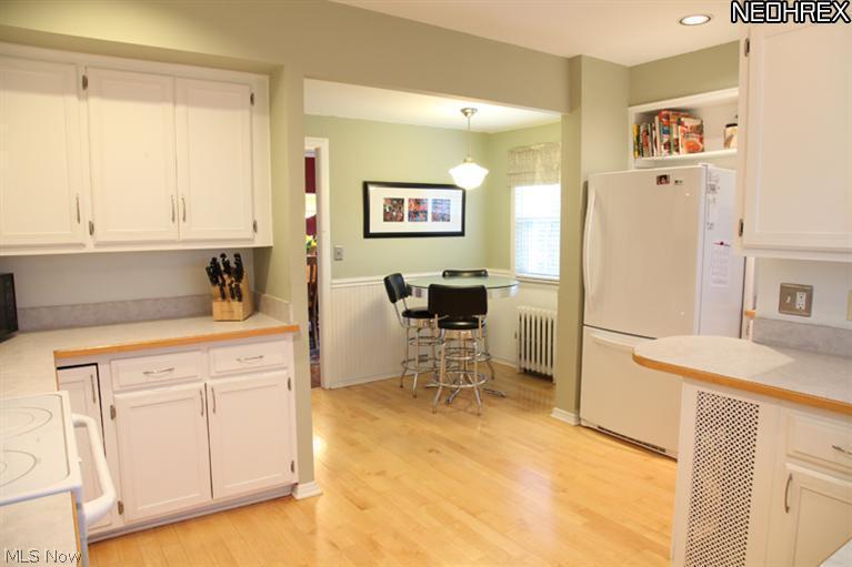 3273 Chadbourne Road Cleveland, OH 44120 - Photo 9 of 25 Updated Eat in Kitchen w/white cabinets & appliances. Light & spacious, direct access to the professionally landscaped rear yard & cobblestone patio through the back door.