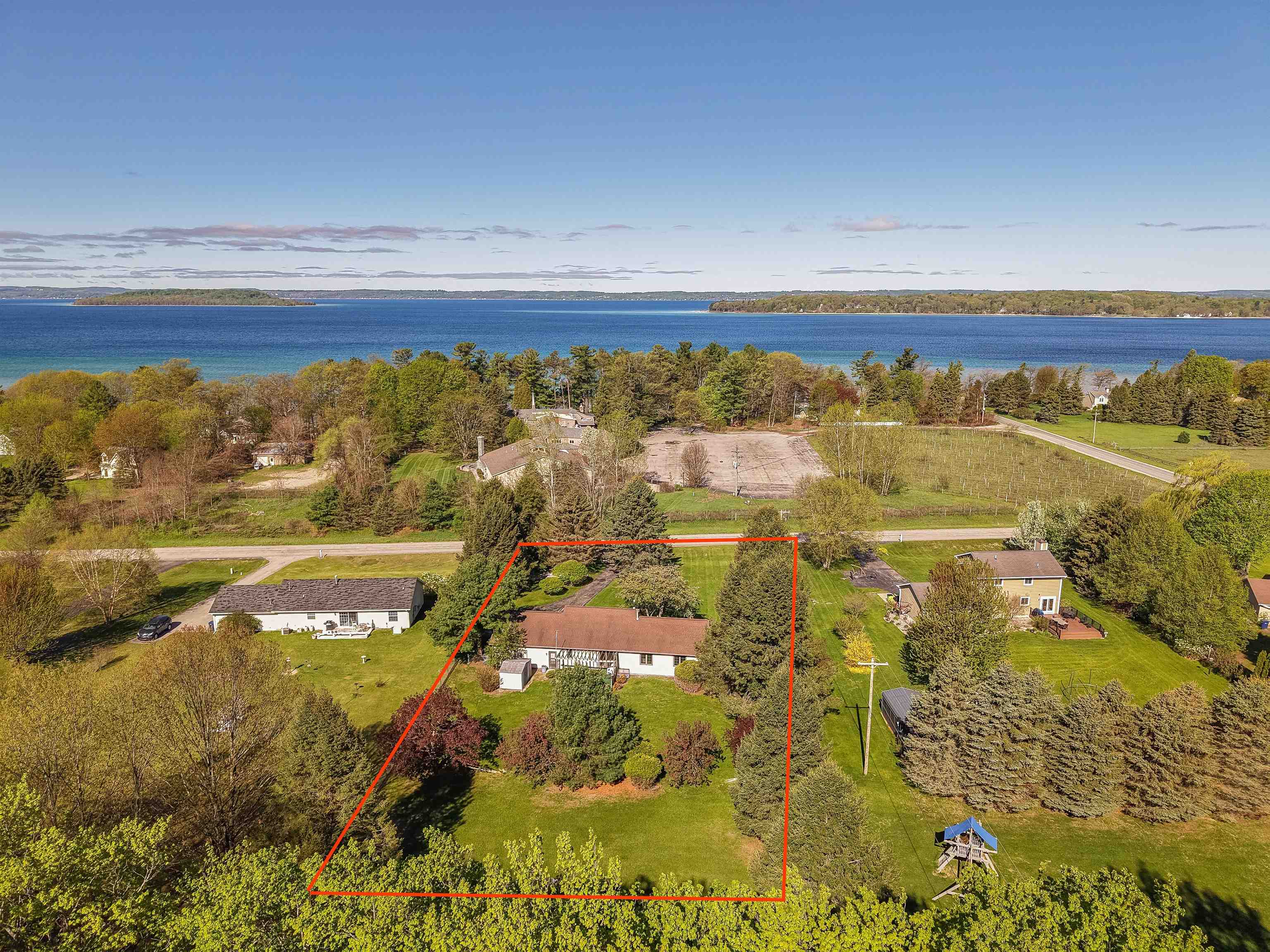 13686 Hedeen Road Traverse City, MI 49686 - Photo 1 of 56 Looking from the back of the home, towards West Bay and The Jolly Pumpkin
