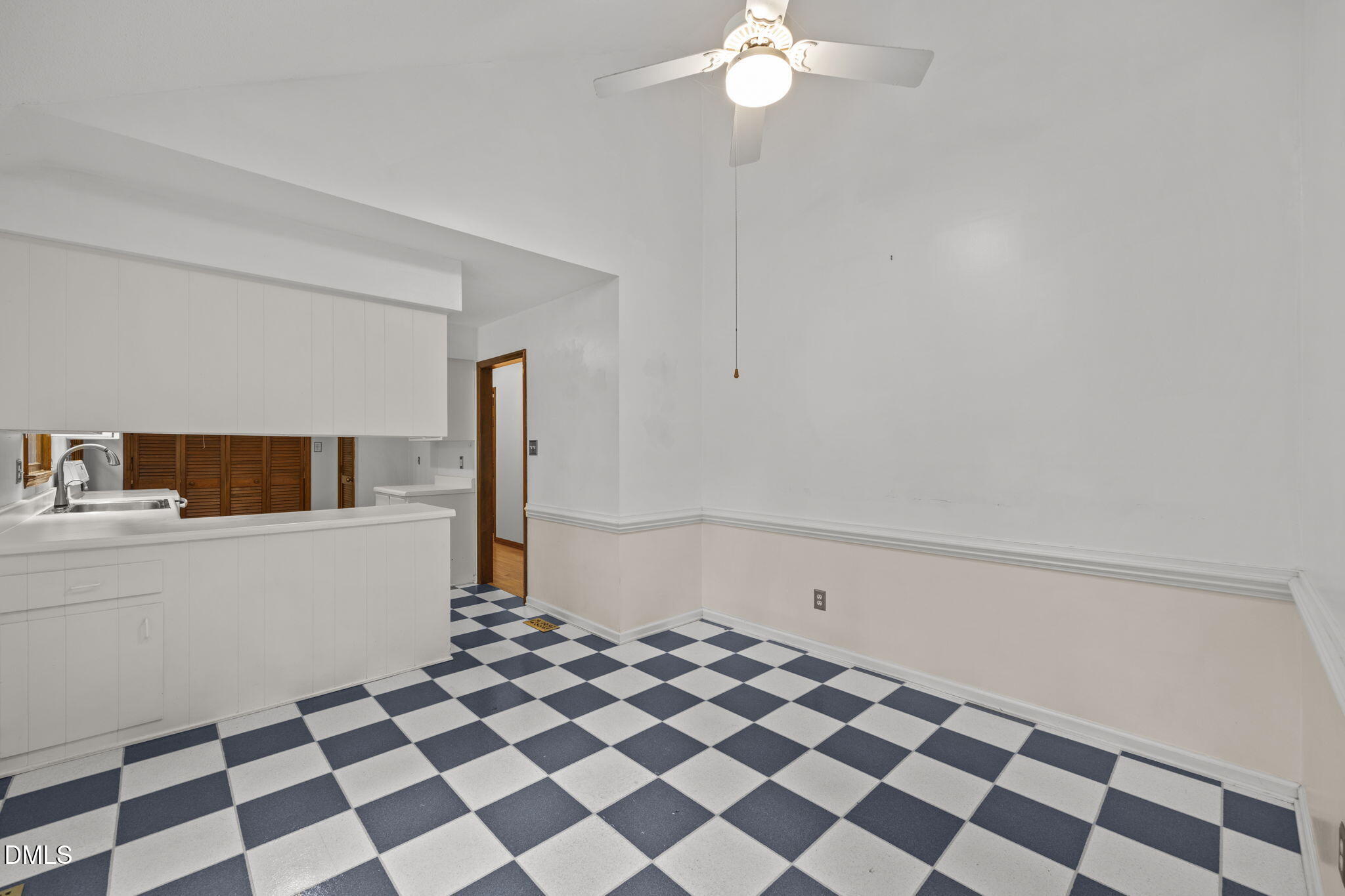 2713 Salisbury Plain Raleigh, NC 27613 - Photo 13 of 39 a view of a livingroom with a black and white checkered floor